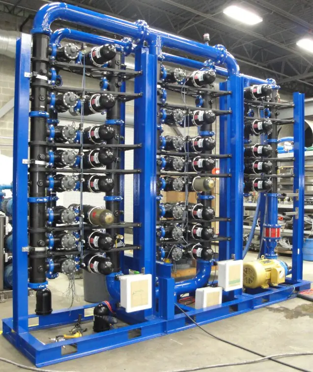 A large rack of pipes and valves in a warehouse.
